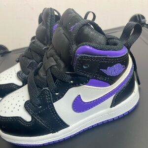 Purple, black and white Jordan Nike toddler shoe